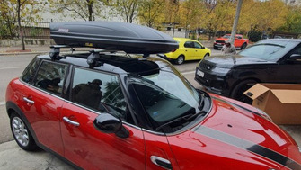 Mini Cooper One with Menabo Tema roof bars and a Menabo Marathon roof box