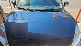 Suzuki Swift with Menabo Delta roof bars and a Thule ProRide 598 bike rack