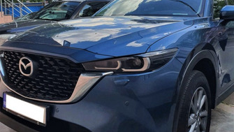 Mazda CX-5 with Menabo Delta roof bars and two Thule FreeRide 532 bike racks