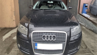 Audi A3 with Menabo Tema roof bars and a Menabo Mania roof box