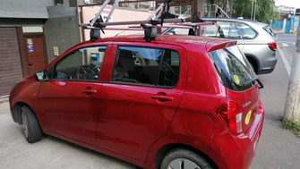 Suzuki Celerio with Menabo Delta roof bars and two Menabo Juza bike racks