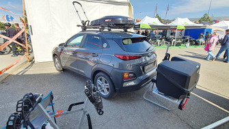 Hyundai Kona with a Menabo Alcor 2 towbar bike rack and a Menabo Mizar towbar cargo box