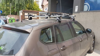 BMW X3 with Menabo Tema roof bars and a Thule FreeRide 532 bike rack