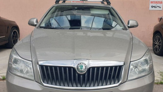 Skoda Octavia with Menabo Tema roof bars and Menabo Iron bike racks