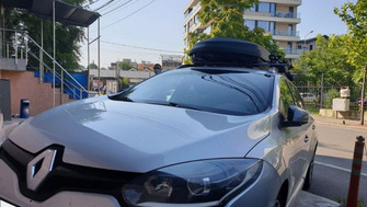Renault Megane with Menabo Sherman roof bars, a Menabo Diamond roof box and a Thule FreeRide 532 bike rack