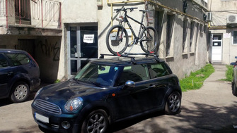 Mini Cooper with Menabo Tema Steel roof bars and a Menabo Iron bike rack