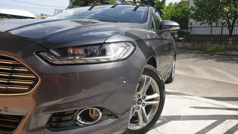 Ford Mondeo with K39 roof bars and a K39 Orion bike rack