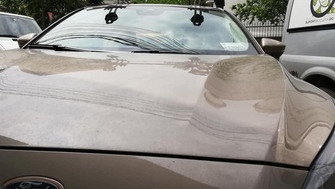 Ford Focus with Menabo Delta Silver roof bars and Thule FreeRide bike racks