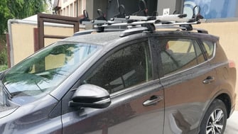 Toyota RAV4 with Menabo Jackson roof bars and a Menabo Juza bike rack