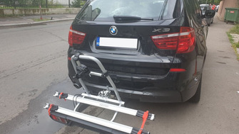 BMW X5 with a Menabo Project Tilting 2 towbar bike rack