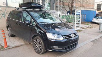 Volkswagen Sharan with Menabo Jackson roof bars and a Menabo Mania roof box