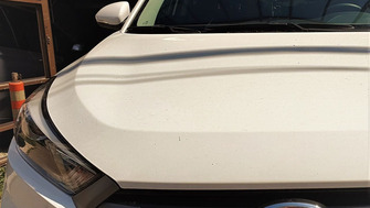 Hyundai Tucson with Menabo Tiger Silver roof bars and a Menabo Mania roof box