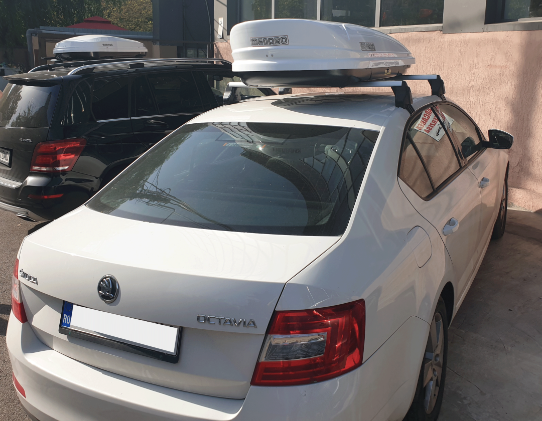 Skoda Octavia III (5E) alba cu cutie portbagaj alba Menabo Mania pe bare transversale - poza 5 Skoda Octavia III (5E) alba cu cutie portbagaj alba Menabo Mania pe bare transversale - poza 5