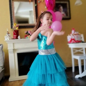 Beautiful tulle ruffles and shimmering girls turquoise dress
