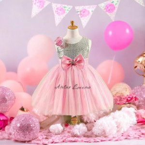 Shimmering silver dress with pink tulle and bow