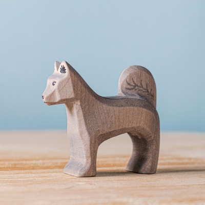 Close-up of the Shurik Dog figurine, highlighting its detailed features and friendly expression.