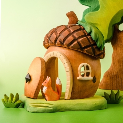 Back view of the wooden acorn house highlighting the smooth wood finish and back window