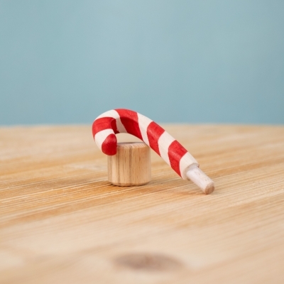 Festive Candy Cane wooden figure beside interchangeable base.