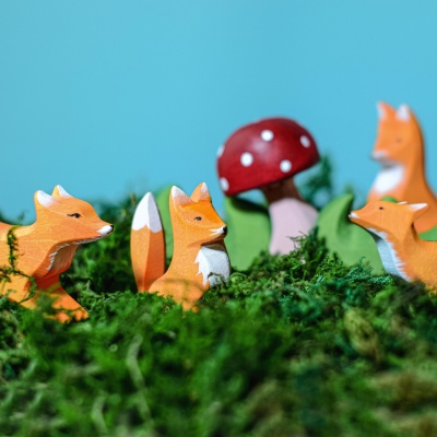 Playful Wooden Fox Cub Sitting Figurine