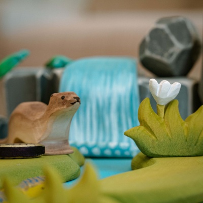 Sustainable wooden grass toy with non-toxic paints.