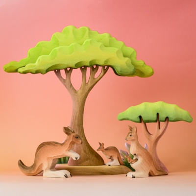 Handmade wooden kangaroo family under trees with forest play scene