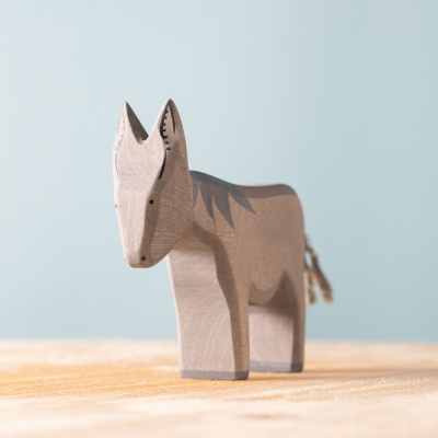 Close-up photo of the Donkey Standing, highlighting its hand-painted details, soft mane and tail, and playful expression.