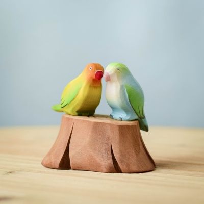 "Tree Stump and Lovebirds wooden toy set featuring Green and Blue Lovebirds perched on a handcrafted stump.