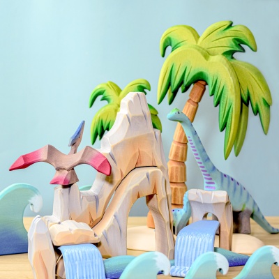 Pteranodon flying over cliffs and waves in a vibrant dinosaur play world.