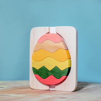 BumbuToys' Egg Puzzle, a colorful wooden toy that forms a vibrant egg when stacked together.