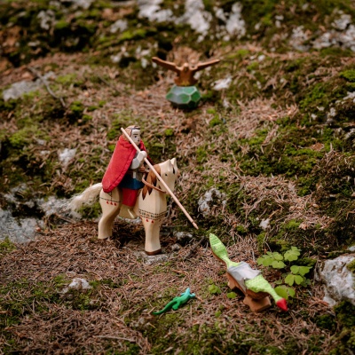 St George wooden toy defeating a wooden dragon (if you have that available).
