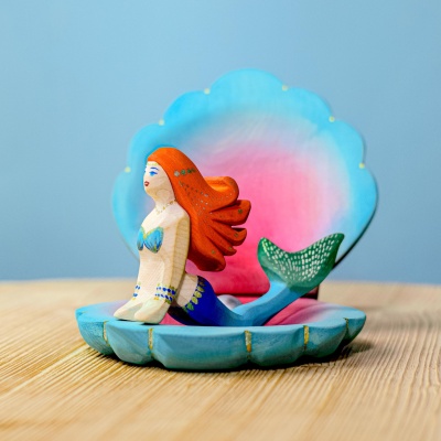 Close-up of the wooden Mermaid figurine, showcasing detailed artistry