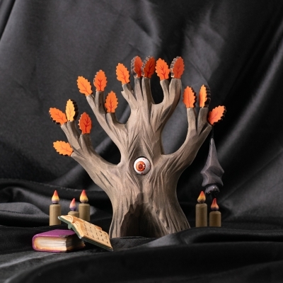 Watching Oak Orange tree toy in seasonal play scene with candles and bat.
