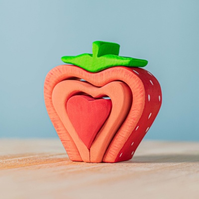 BumbuToys' wooden Strawberry with a heart center, ripe for imaginative play.