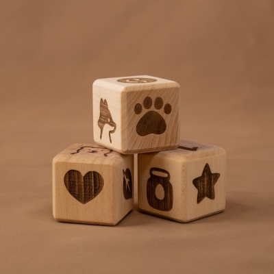 wooden blocks with fox paw print and heart symbols on beige background