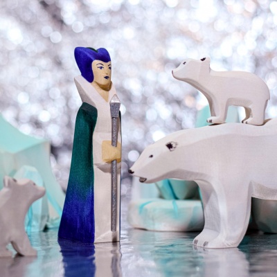 The Polar Bear incorporated into a sensory bin with white and blue textures like faux snow, ice pebbles, and ocean-themed objects.