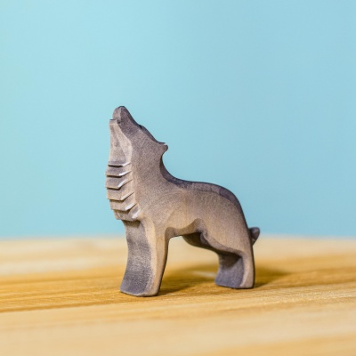 Child engaging with the Wolf Howling toy, fostering a connection with nature