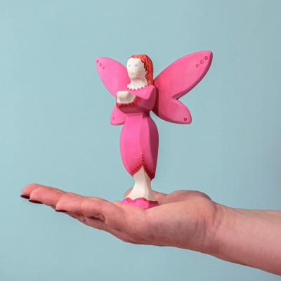 Handcrafted fairy figurine in shades of pink.