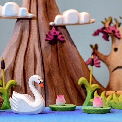 Bat wooden figure in a play scene, inspiring curiosity about wildlife
