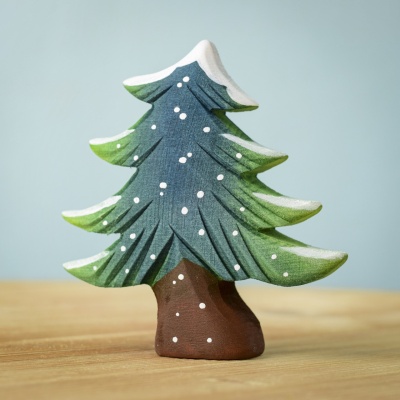 Hand-painted wooden snowy fir tree figurine.