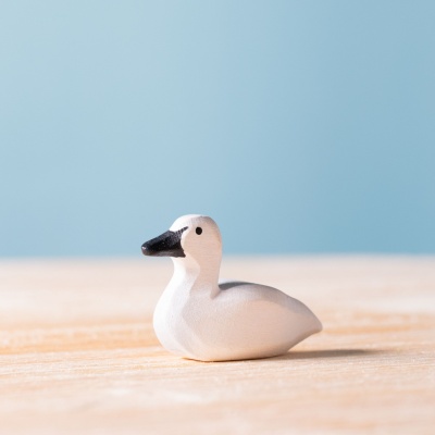 Hand-painted "Cygnet" wooden figure by Bumbu Toys, symbolizing grace.