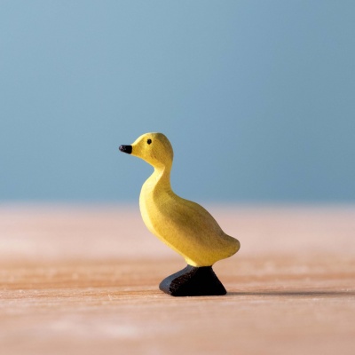 Sunny yellow Ducklings figure by BumbuToys, poised for playful adventures in and out of the water.