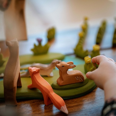 Natural wood fawn toy encouraging imaginative play.