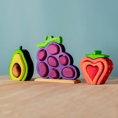 BumbuToys' vibrant wooden Grape, Avocado, and Strawberry set on display.