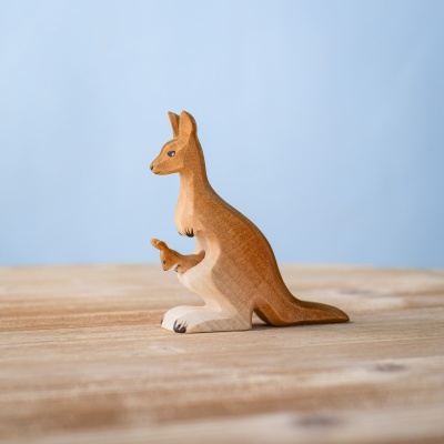 Handmade wooden mama kangaroo with joey on wooden surface