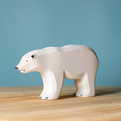 Majestic wooden polar bears by BumbuToys, accompanied by an ice floe, ready for Arctic adventures.