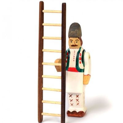 Person using the wooden step ladder to change a lightbulb.