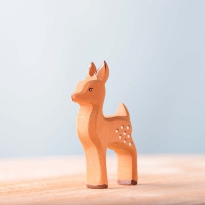 Sustainable wooden deer herd for imaginative play.