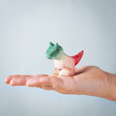 Baby Carnotaurus held in palm to illustrate size and detail.