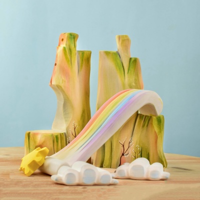 Disassembled Rainbow Cliff playset showing individual components like the rainbow waterfall, sun, and clouds.