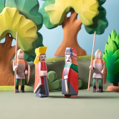 Child playing with Stephen the Great figure and other Romanian historical figures